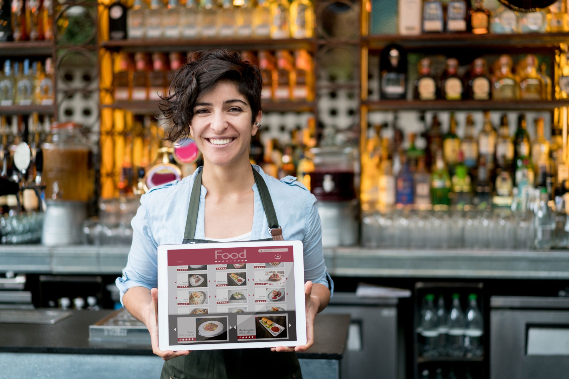 Waitress holding online menu on a tablet computer