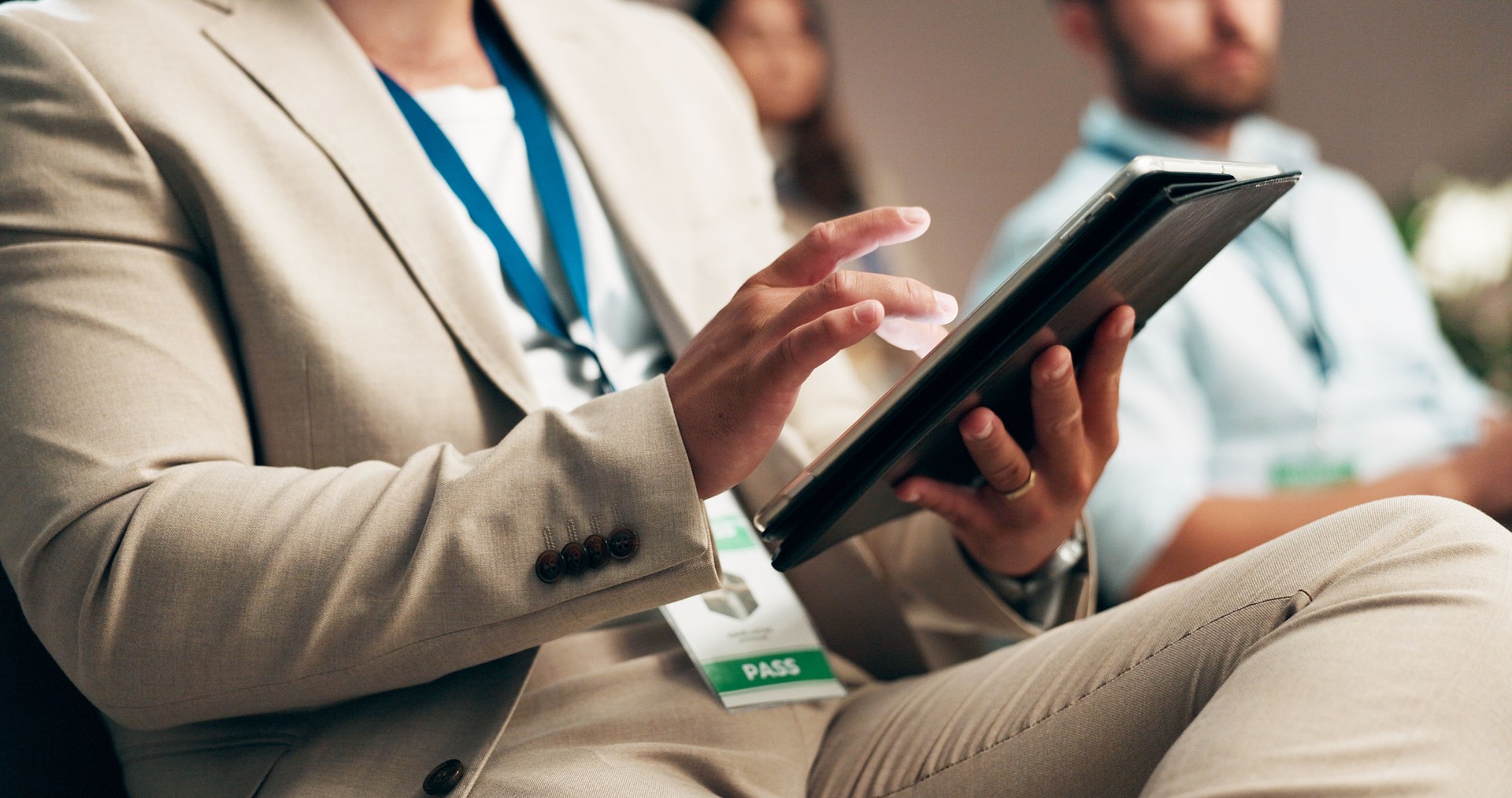 Business, hands or tablet in conference audience for online notes, seminar information or meeting agenda. Global convention, person or scroll on digital app for training feedback or learning workshop